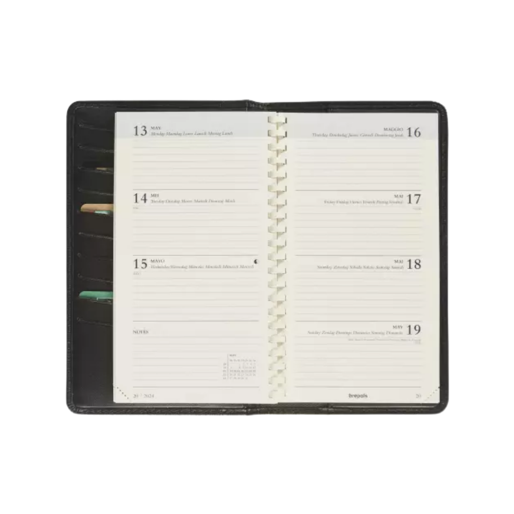 Close-up interior view of the black leather A6 diary with a week-to-view planner and internal organization.