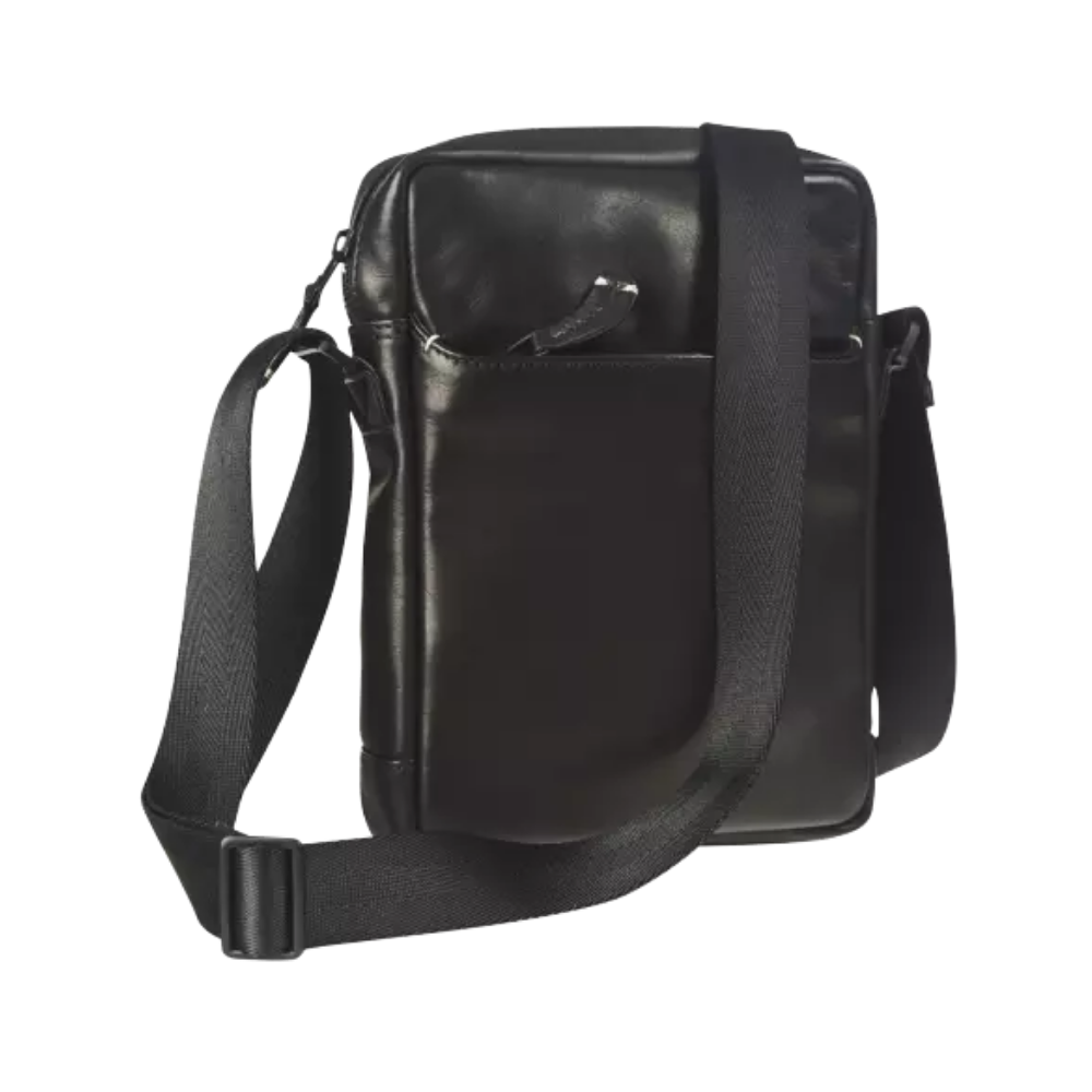 Side view of the black leather shoulder bag with an adjustable strap and zipper closure.