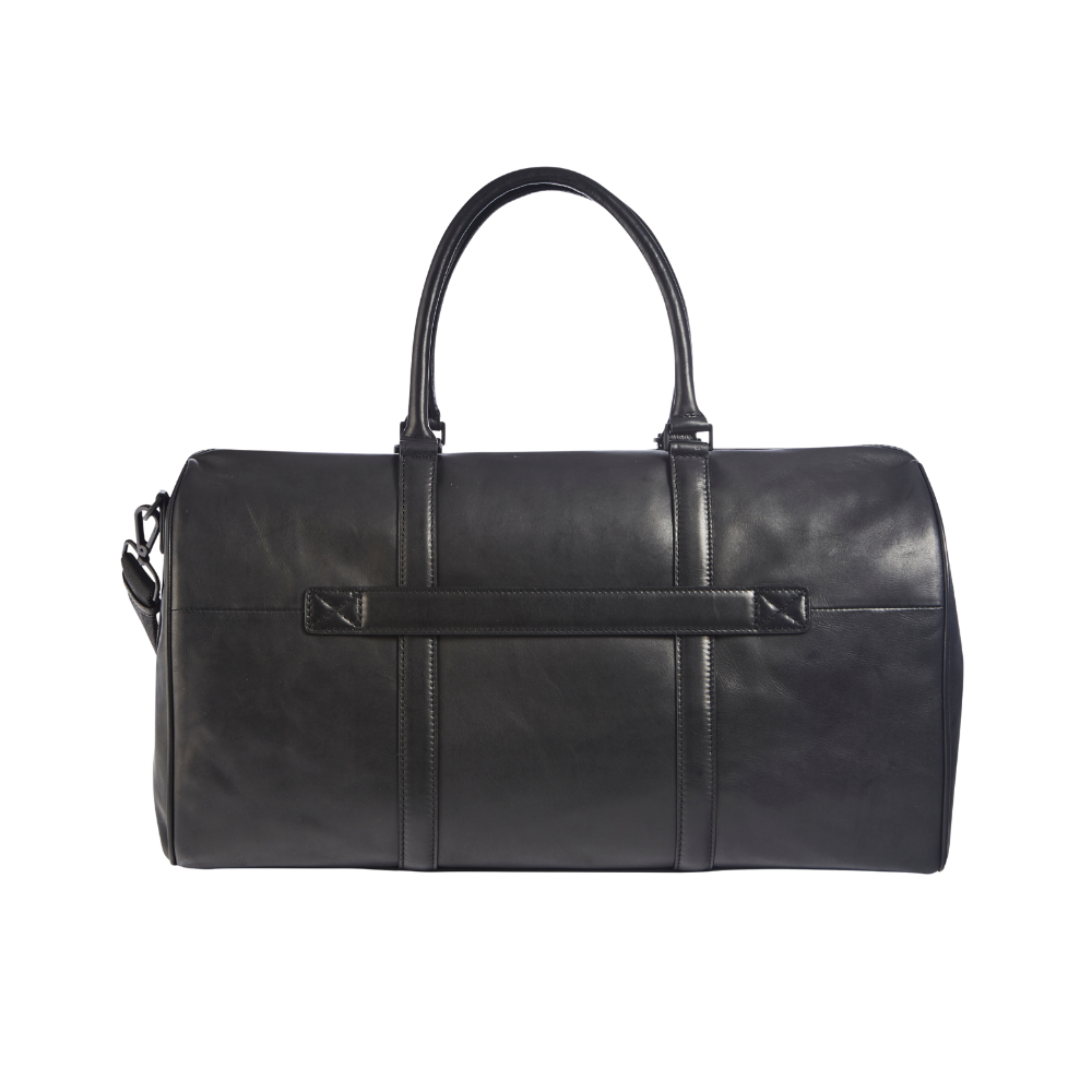 Side view of the black leather weekend bag showing the design and shoulder strap.