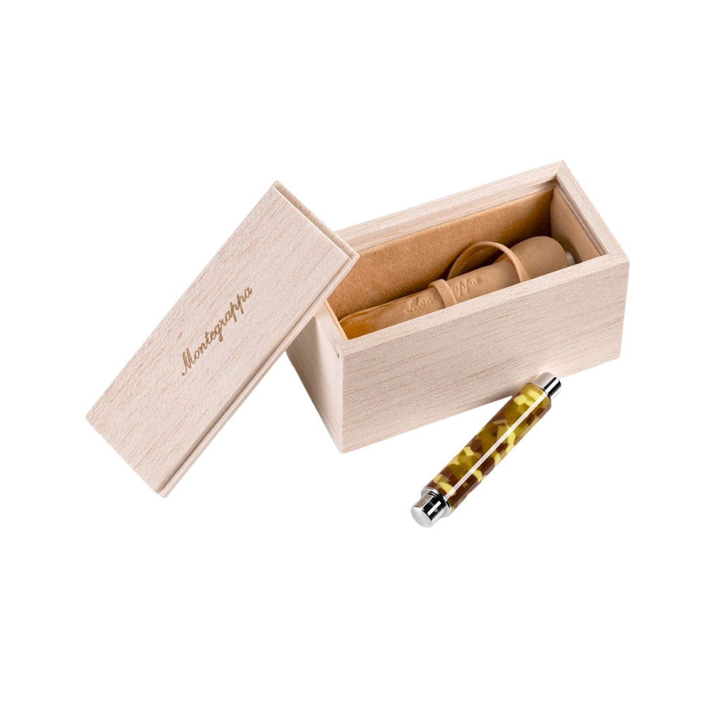 Montegrappa Gnomo Obsession Buttermilk Steel Fountain Pen displayed inside a premium gift box.