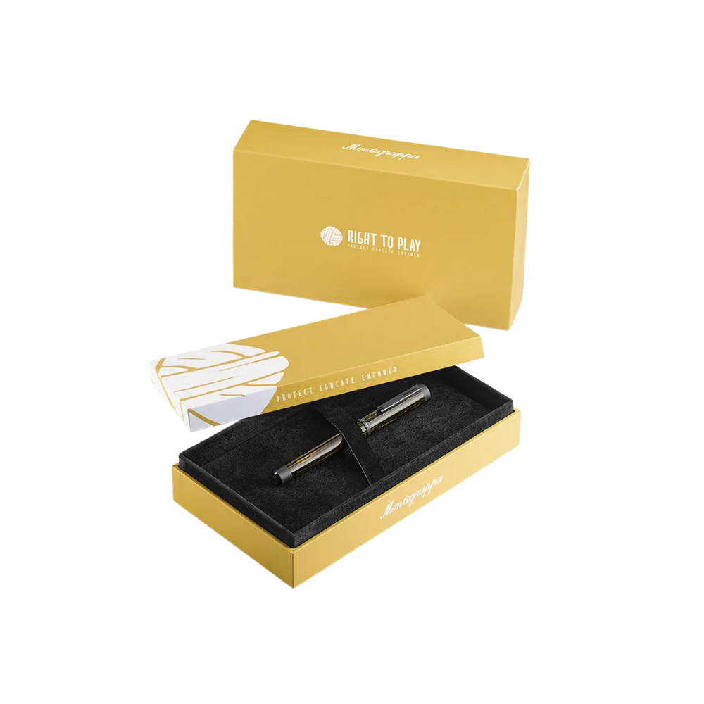 Montegrappa Right To Play Ultra Black IP Steel Fountain Pen displayed inside a yellow premium gift box.