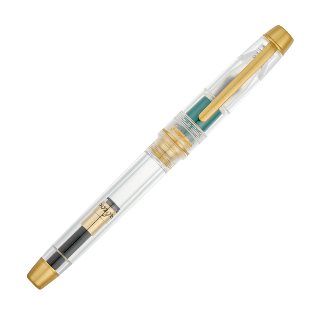 Esterbrook × Accutron Spaceview Gold Trim Füllfederhalter aus transparentem Acryl mit grünem Griffstück und vergoldeten Metallteilen