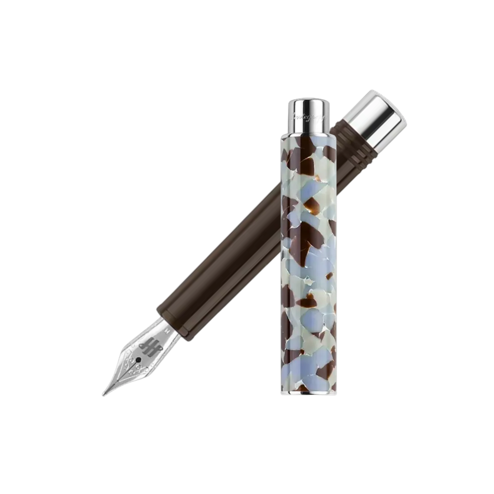 Montegrappa Gnomo Obsession Mocha Steel Fountain Pen, front view showcasing the nib and the blend of mocha brown and light-colored resin design.